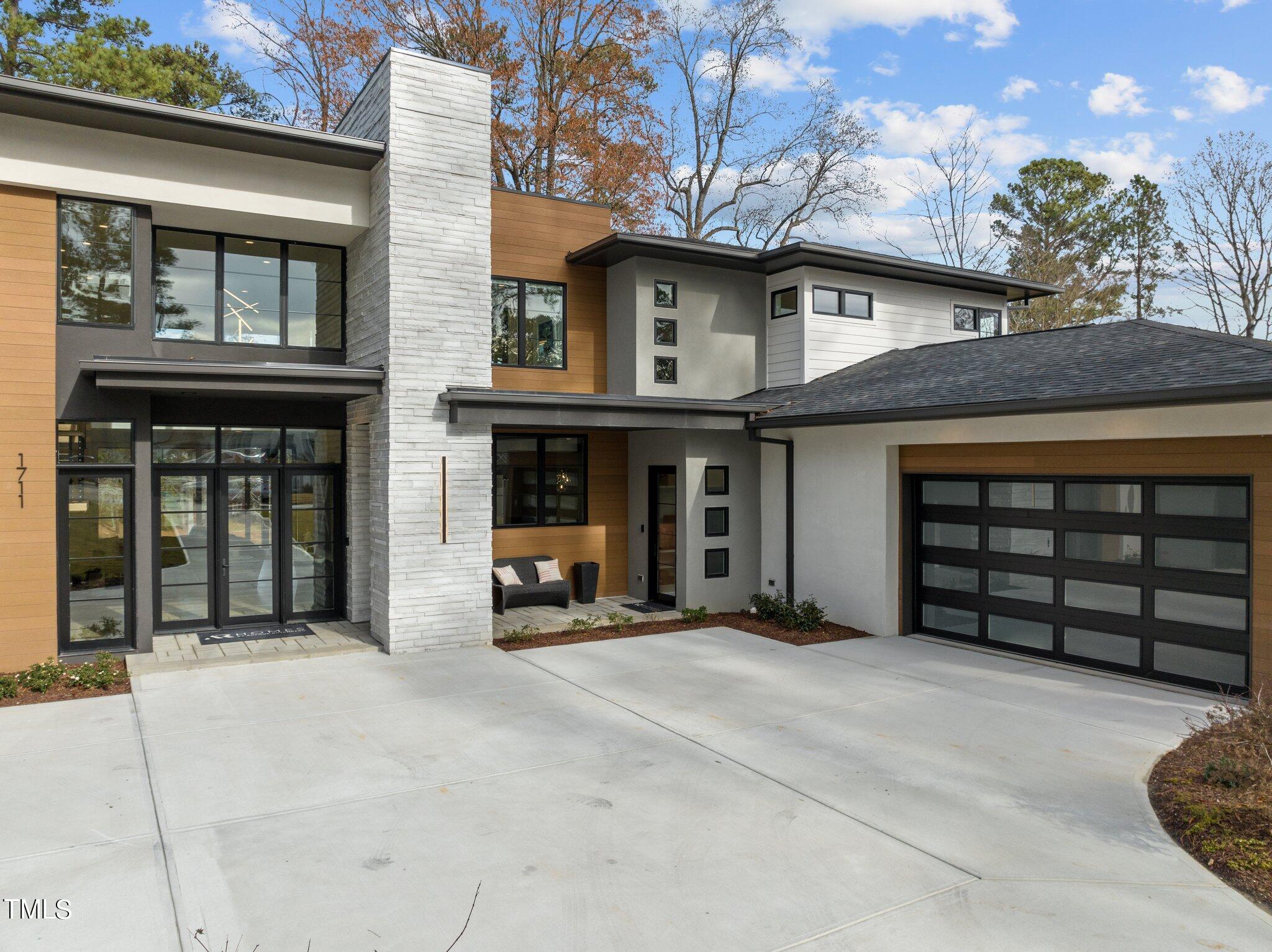 1711 Hunting Ridge Road Raleigh, NC 27615 - Photo 5 of 62 a view of a house with a garage