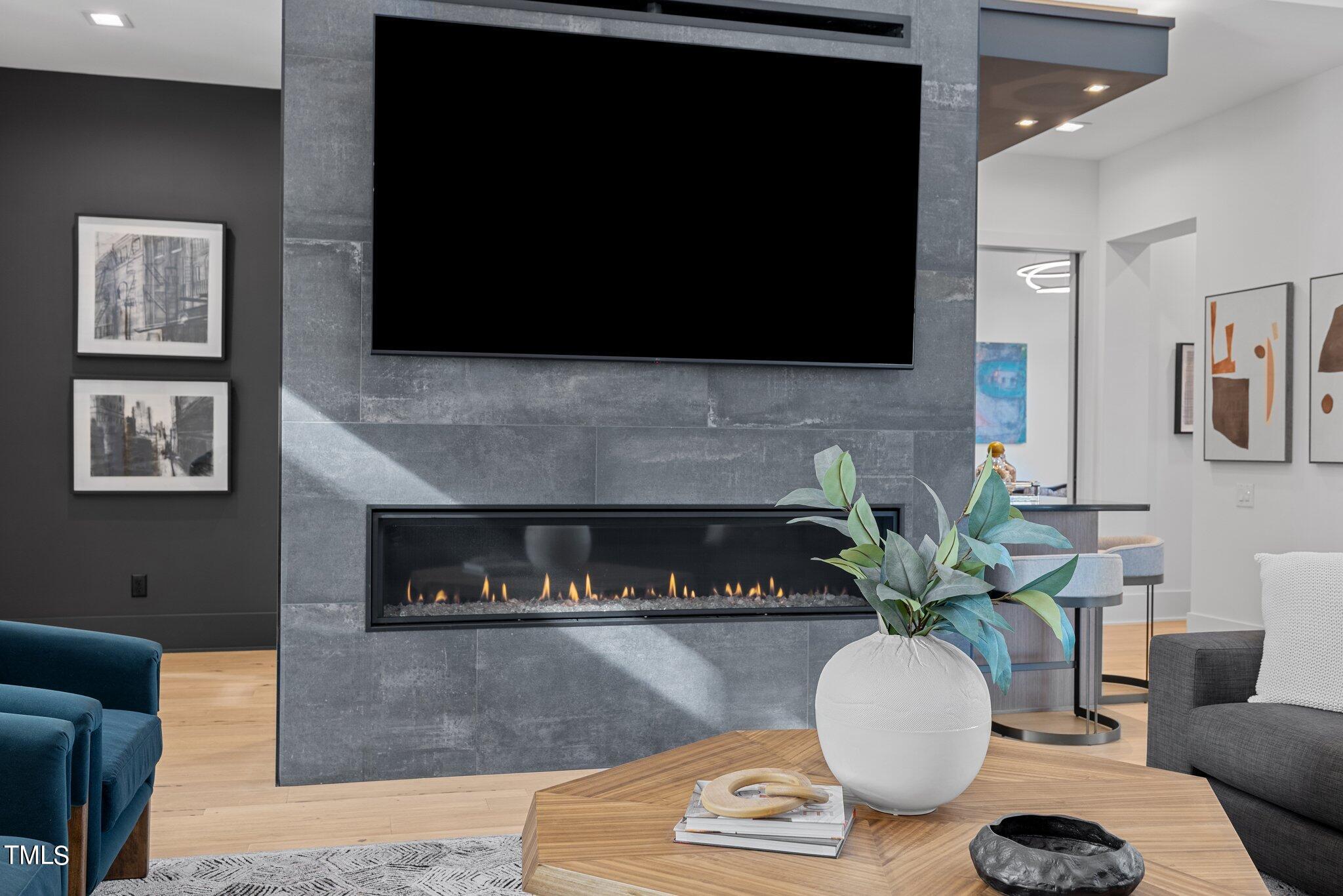 1711 Hunting Ridge Road Raleigh, NC 27615 - Photo 9 of 62 a living room with furniture and a flat screen tv