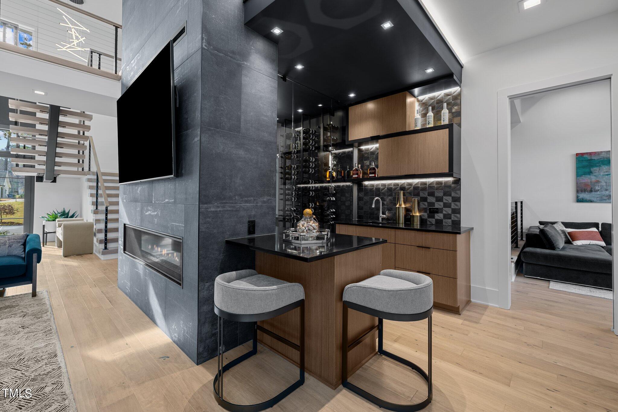 1711 Hunting Ridge Road Raleigh, NC 27615 - Photo 10 of 62 a view of a dining room with furniture and wooden floor