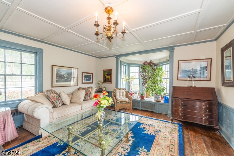 570 Mine Brook Road Bernardsville, NJ 07924 - Photo 15 of 36 a living room with furniture and a chandelier