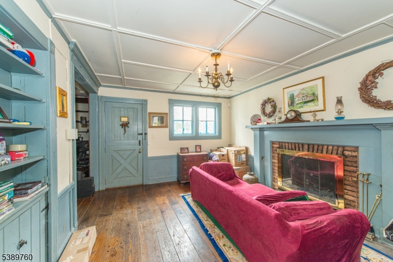 570 Mine Brook Road Bernardsville, NJ 07924 - Photo 17 of 36 a living room with furniture and a fireplace