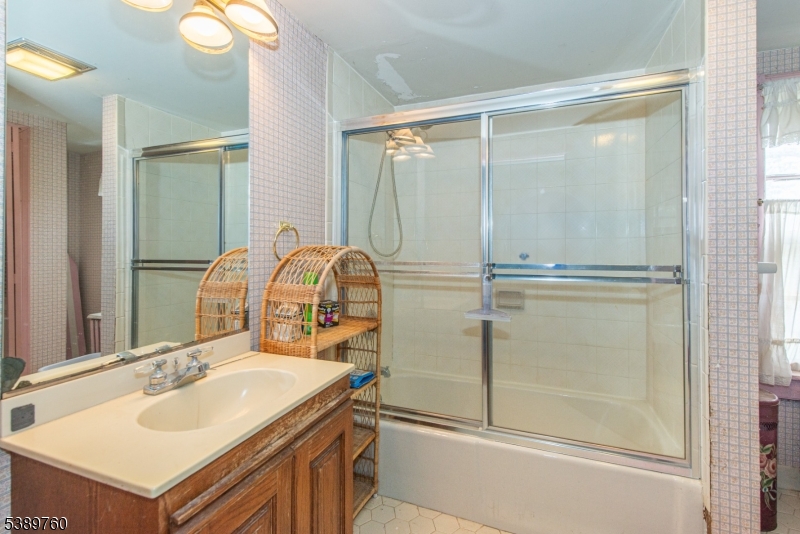 570 Mine Brook Road Bernardsville, NJ 07924 - Photo 21 of 36 a bathroom with a sink and a mirror