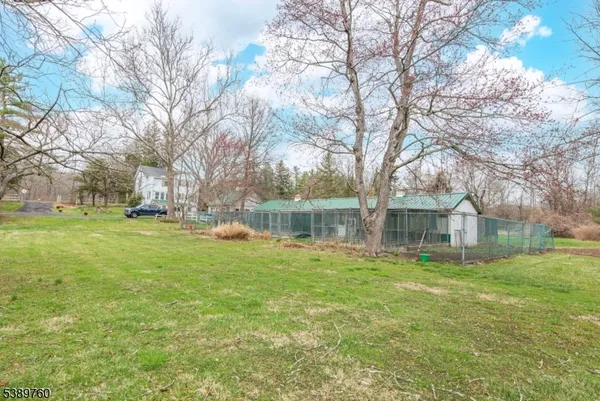 a view of a playground with basketball court