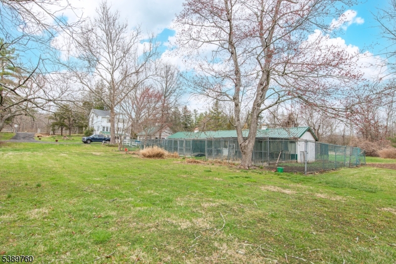 570 Mine Brook Road Bernardsville, NJ 07924 - Photo 25 of 36 a view of a house with a yard