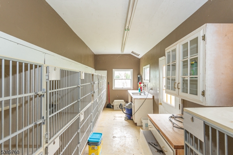 570 Mine Brook Road Bernardsville, NJ 07924 - Photo 29 of 36 a bedroom with furniture and a large window