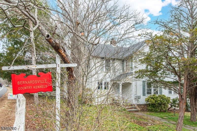 570 Mine Brook Road Bernardsville, NJ 07924 - Photo 3 of 36 a front view of a house with a yard
