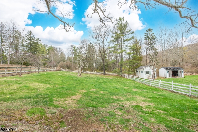 570 Mine Brook Road Bernardsville, NJ 07924 - Photo 35 of 36 a view of a house with a yard
