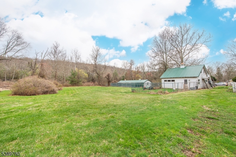 570 Mine Brook Road Bernardsville, NJ 07924 - Photo 36 of 36 a view of a house with a yard