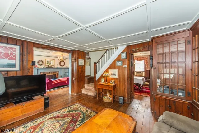 a living room filled with furniture and a large window