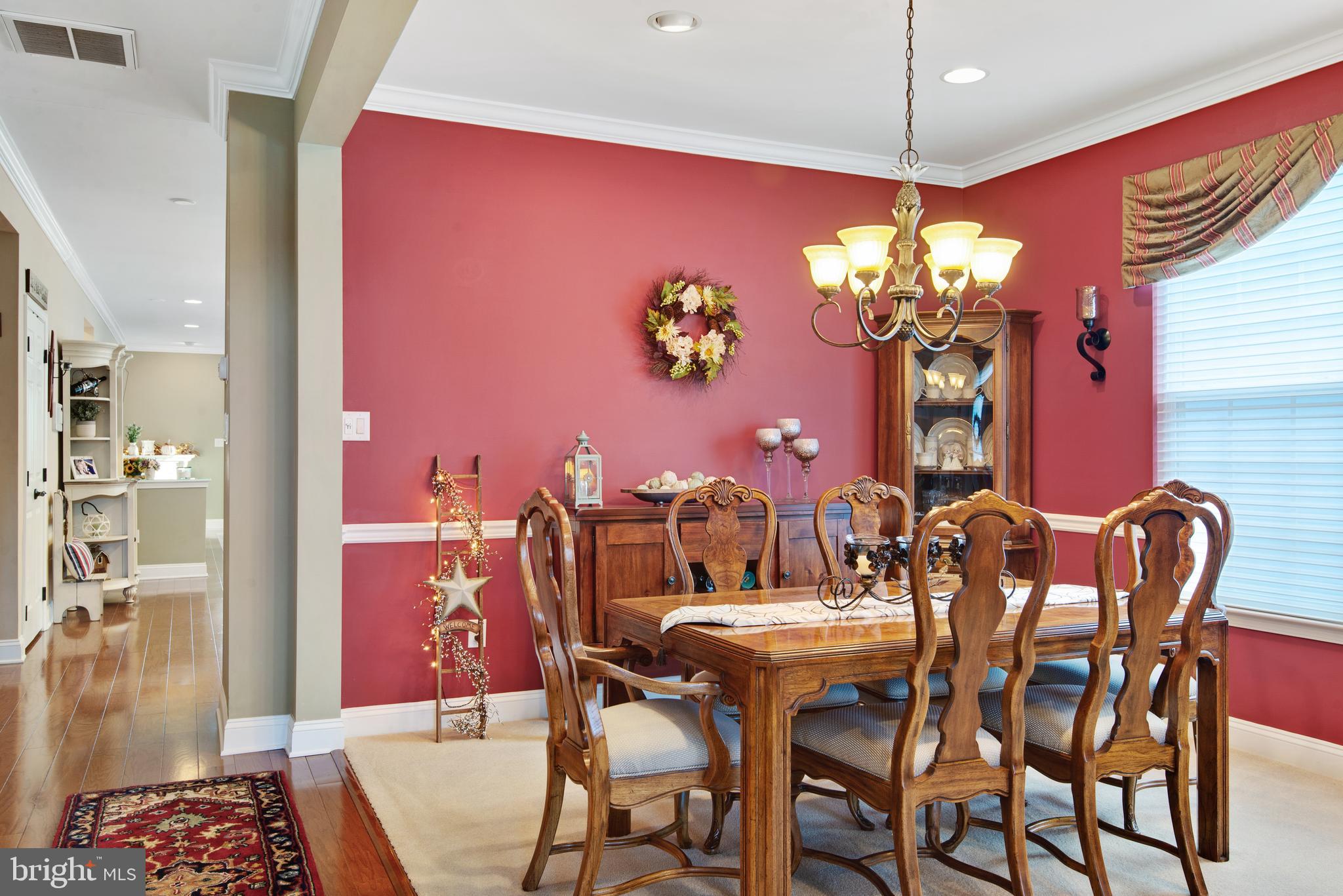 Formal Dining area with chair rail trim