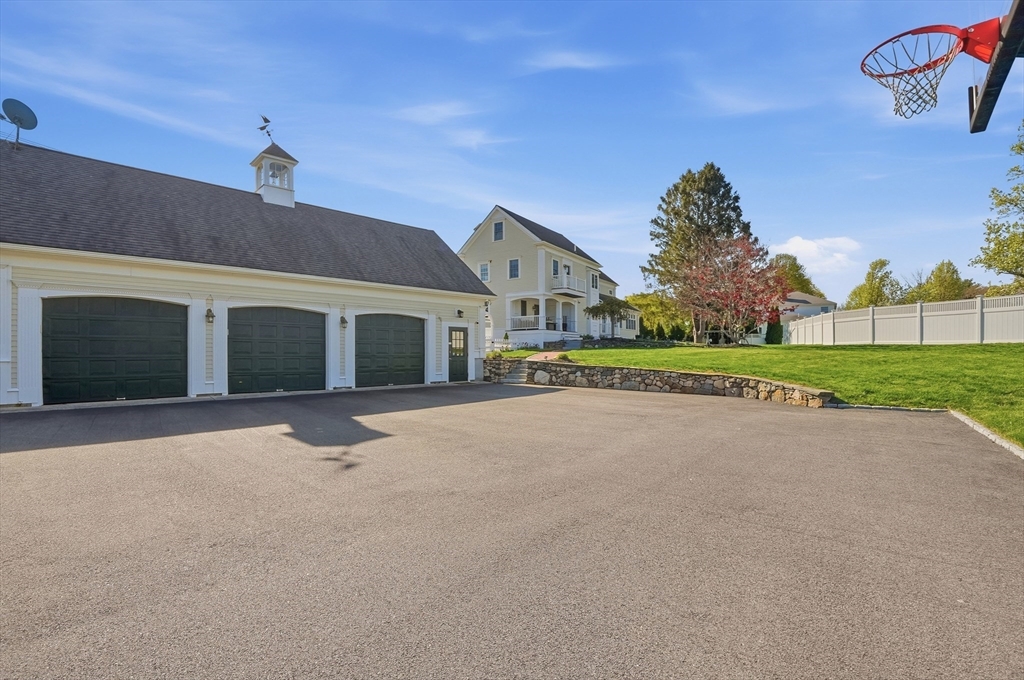 183 Whiting Street Hanover, MA 02339 - Photo 4 of 42 a view of a house with a yard and garage