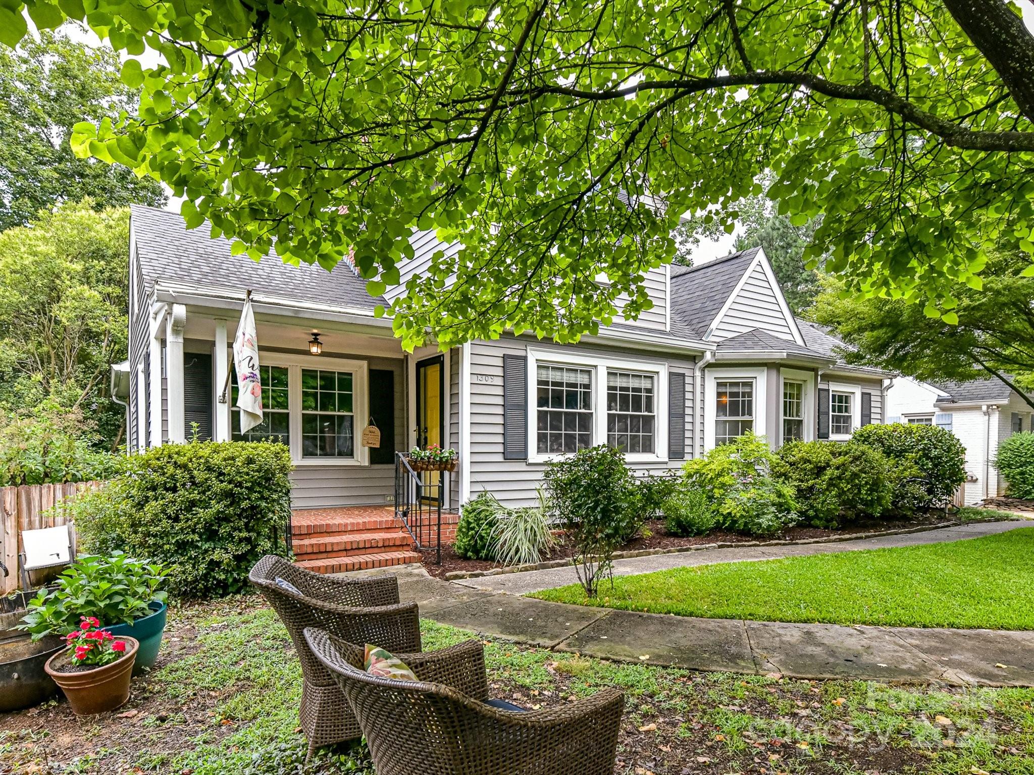 a front view of a house with garden
