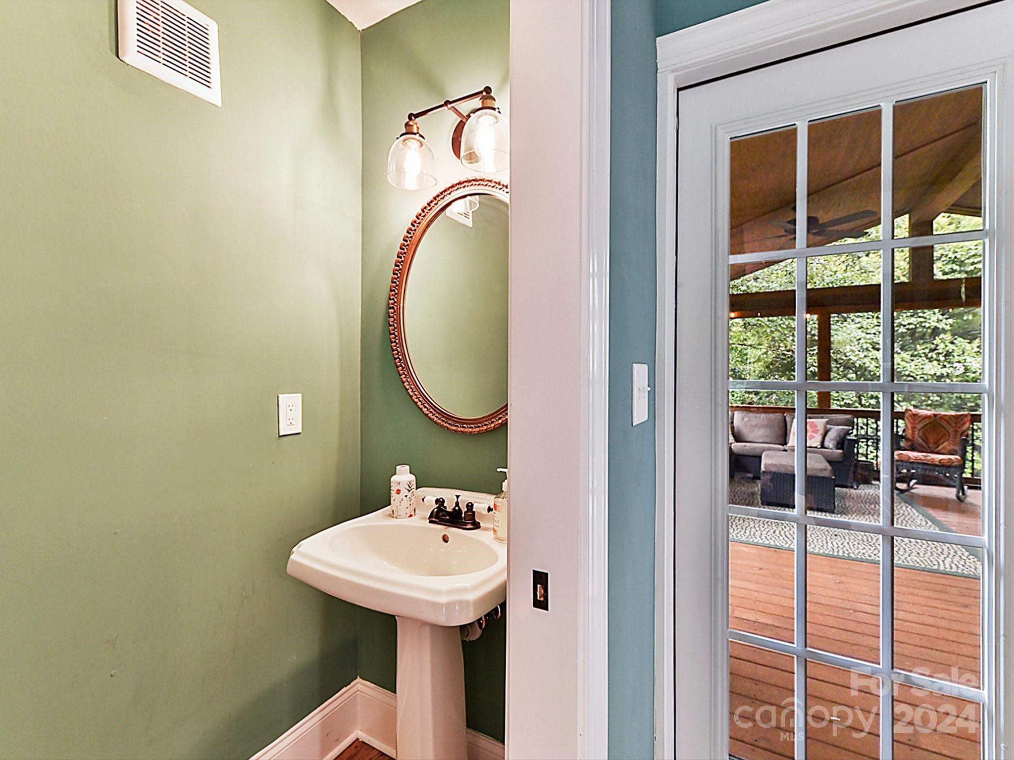 1309 Morningside Drive Charlotte, NC 28205 - Photo 16 of 41 a bathroom with a sink a mirror and a shower