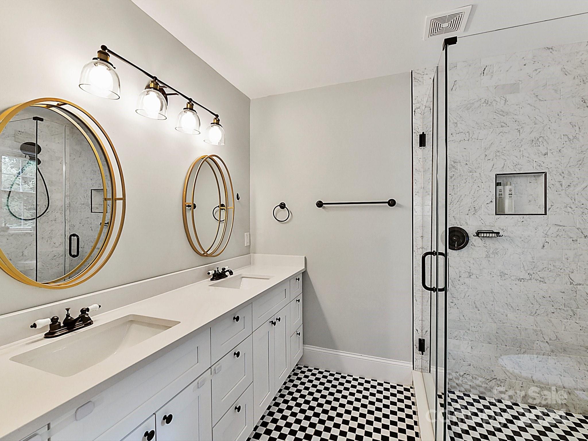 1309 Morningside Drive Charlotte, NC 28205 - Photo 18 of 41 a bathroom with a double vanity sink mirror and shower