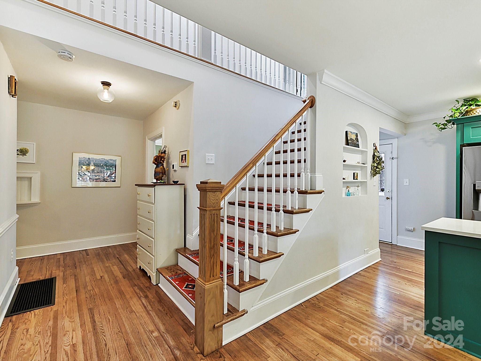 1309 Morningside Drive Charlotte, NC 28205 - Photo 20 of 41 a view of entryway with wooden floor and stairs