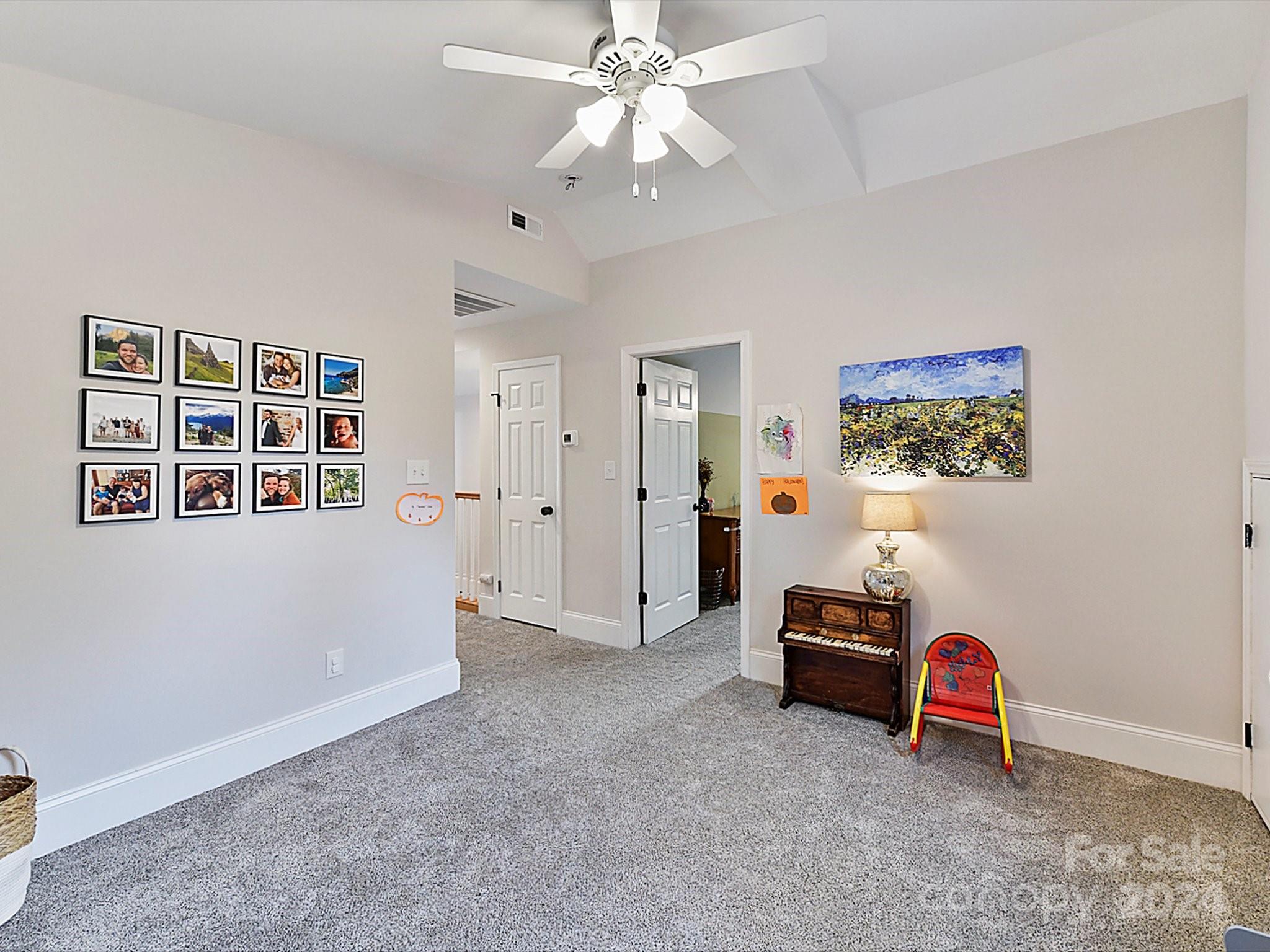 1309 Morningside Drive Charlotte, NC 28205 - Photo 23 of 41 a view of a livingroom with furniture and chandelier fan