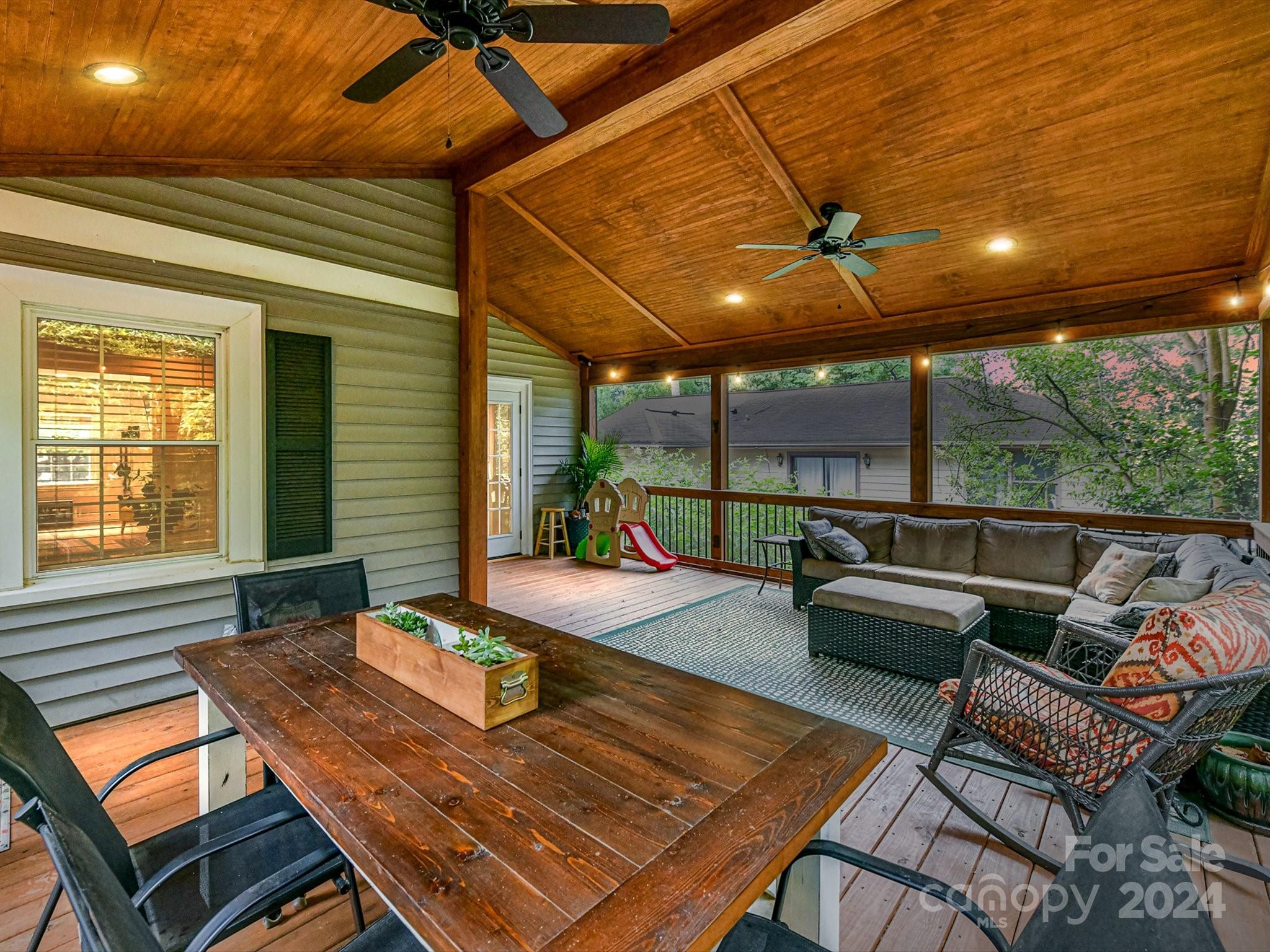 1309 Morningside Drive Charlotte, NC 28205 - Photo 35 of 41 a outdoor space with patio the couches and a dining table and chairs with wooden floor