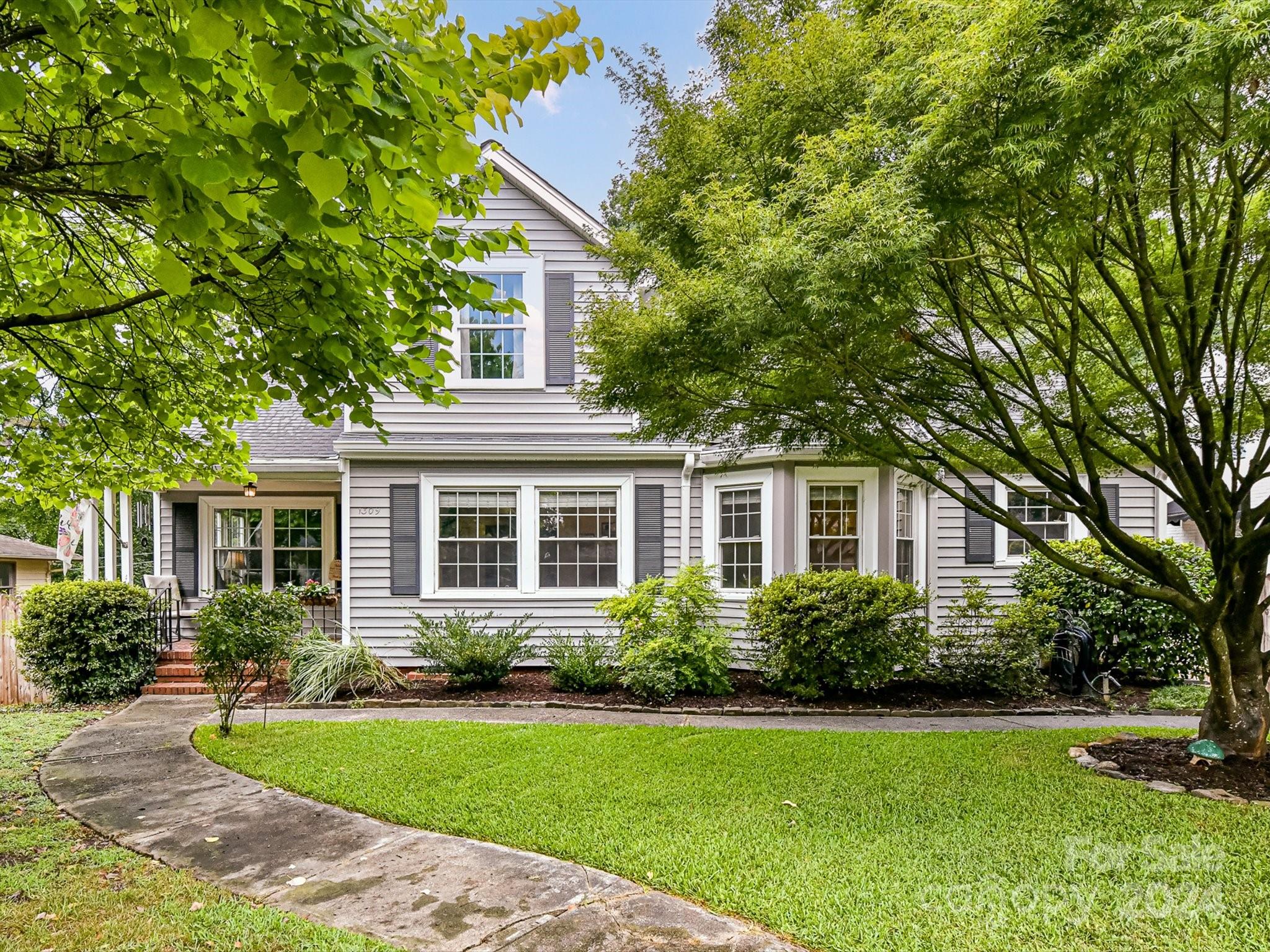 1309 Morningside Drive Charlotte, NC 28205 - Photo 36 of 41 a front view of a house with a yard and trees