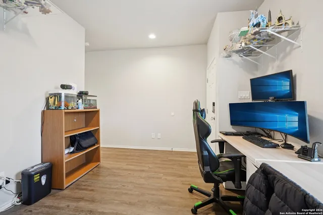 a workspace with furniture and wooden floor
