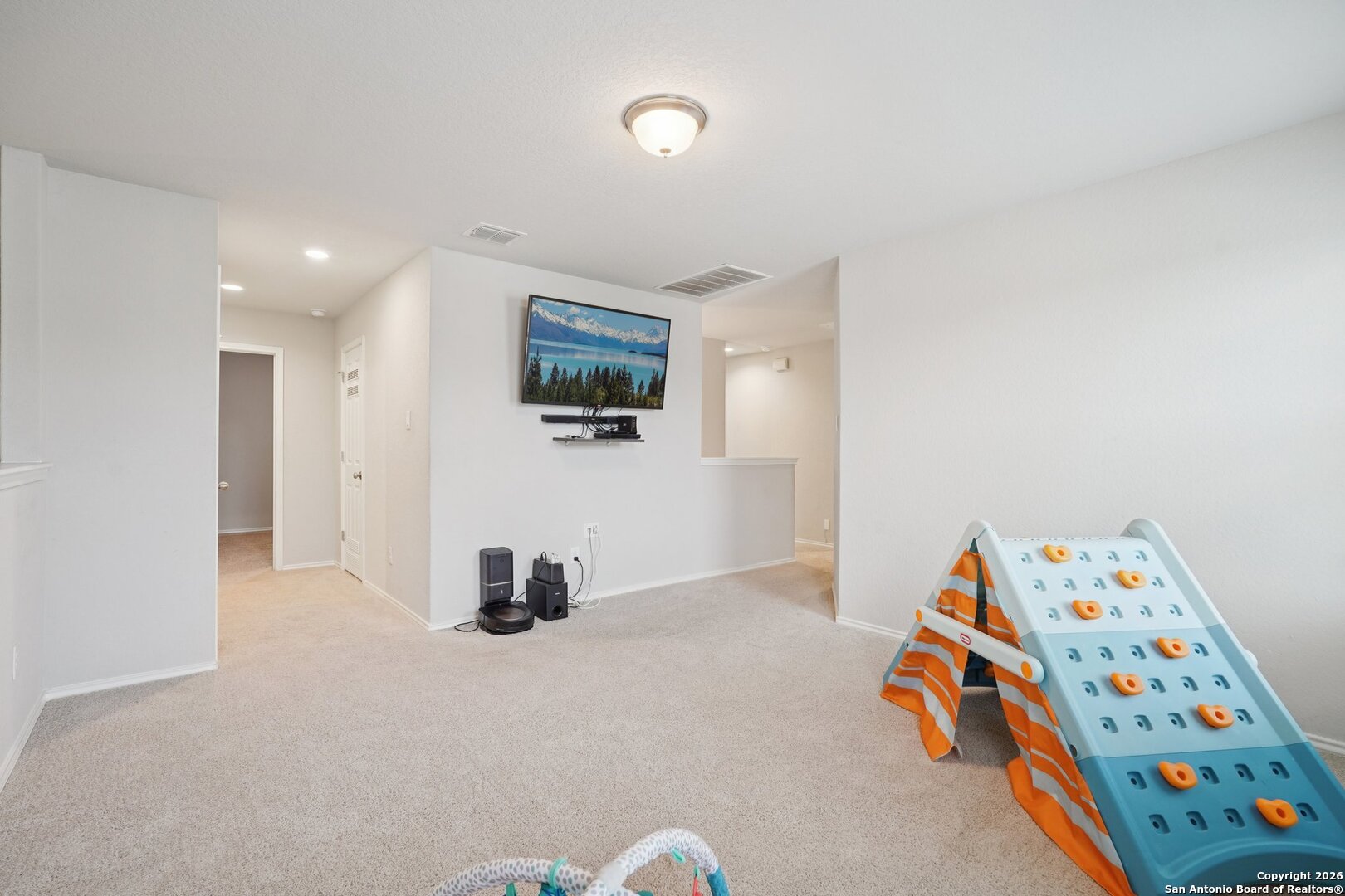 13030 Heathers Reef St. Hedwig, TX 78152 - Photo 19 of 51 a bedroom with furniture and a flat screen tv