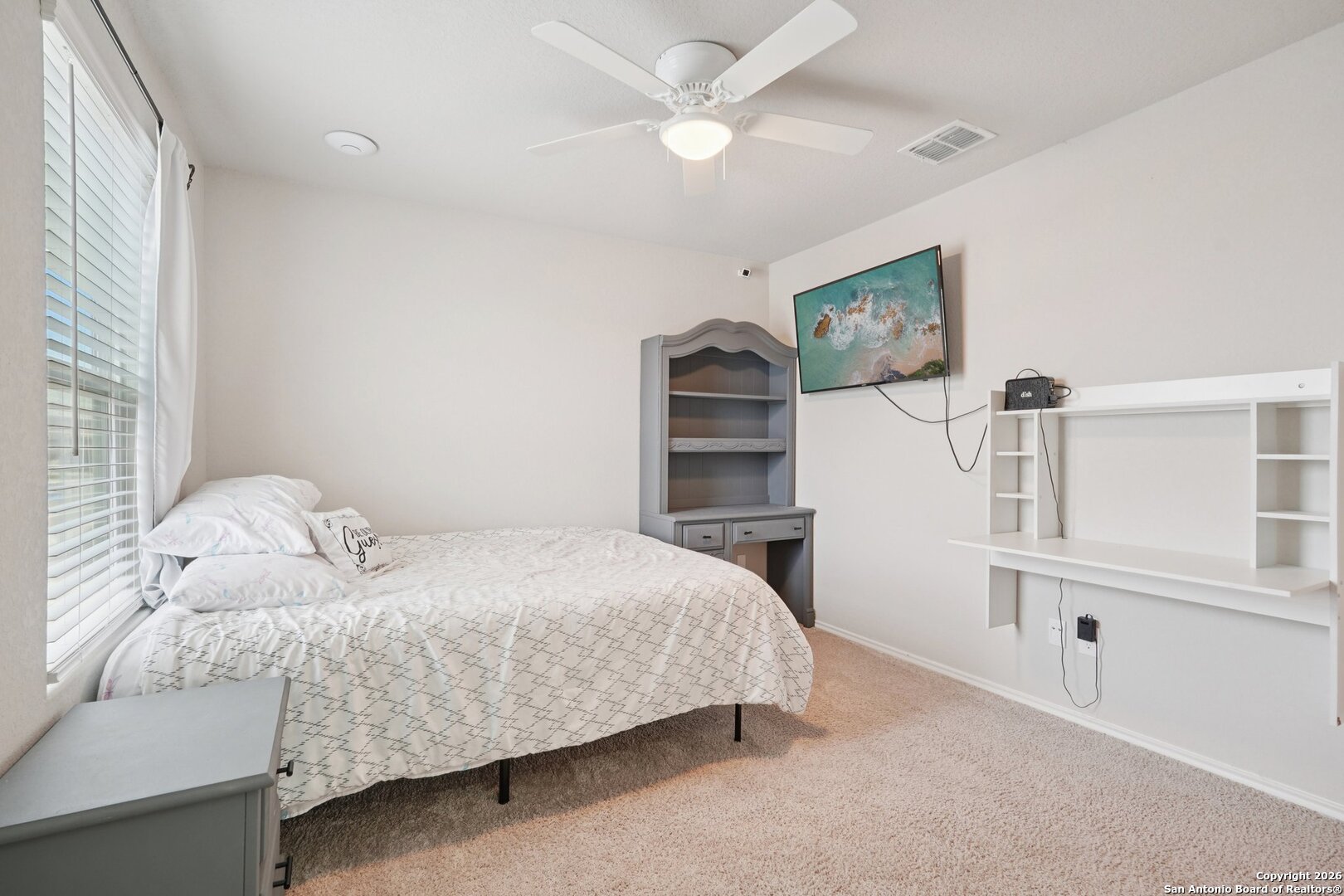 13030 Heathers Reef St. Hedwig, TX 78152 - Photo 24 of 51 a bedroom with a bed and a flat tv screen
