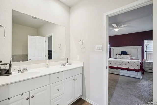 a white bath tub sitting next to a white sink