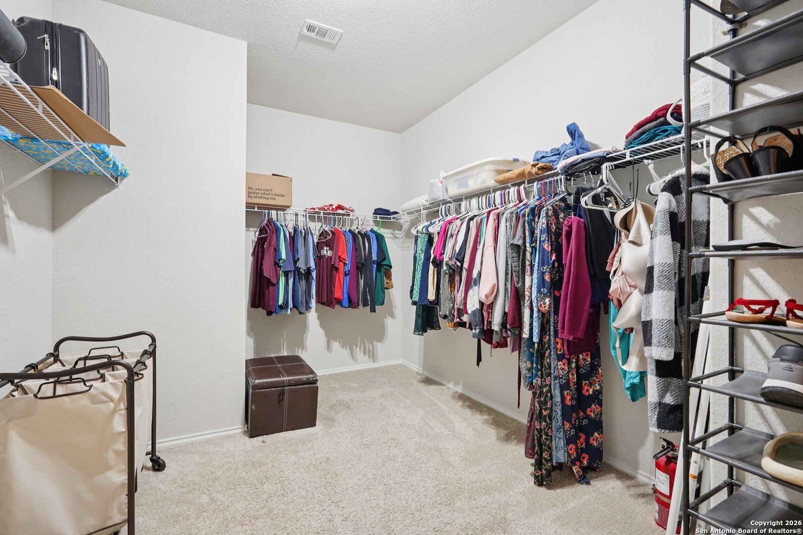 13030 Heathers Reef St. Hedwig, TX 78152 - Photo 31 of 51 a view of walk in closet with clothes