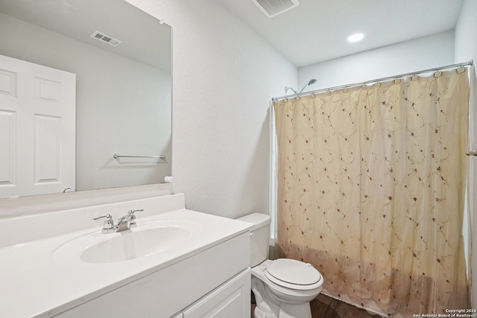 13030 Heathers Reef St. Hedwig, TX 78152 - Photo 34 of 51 a bathroom with a sink a toilet and a mirror