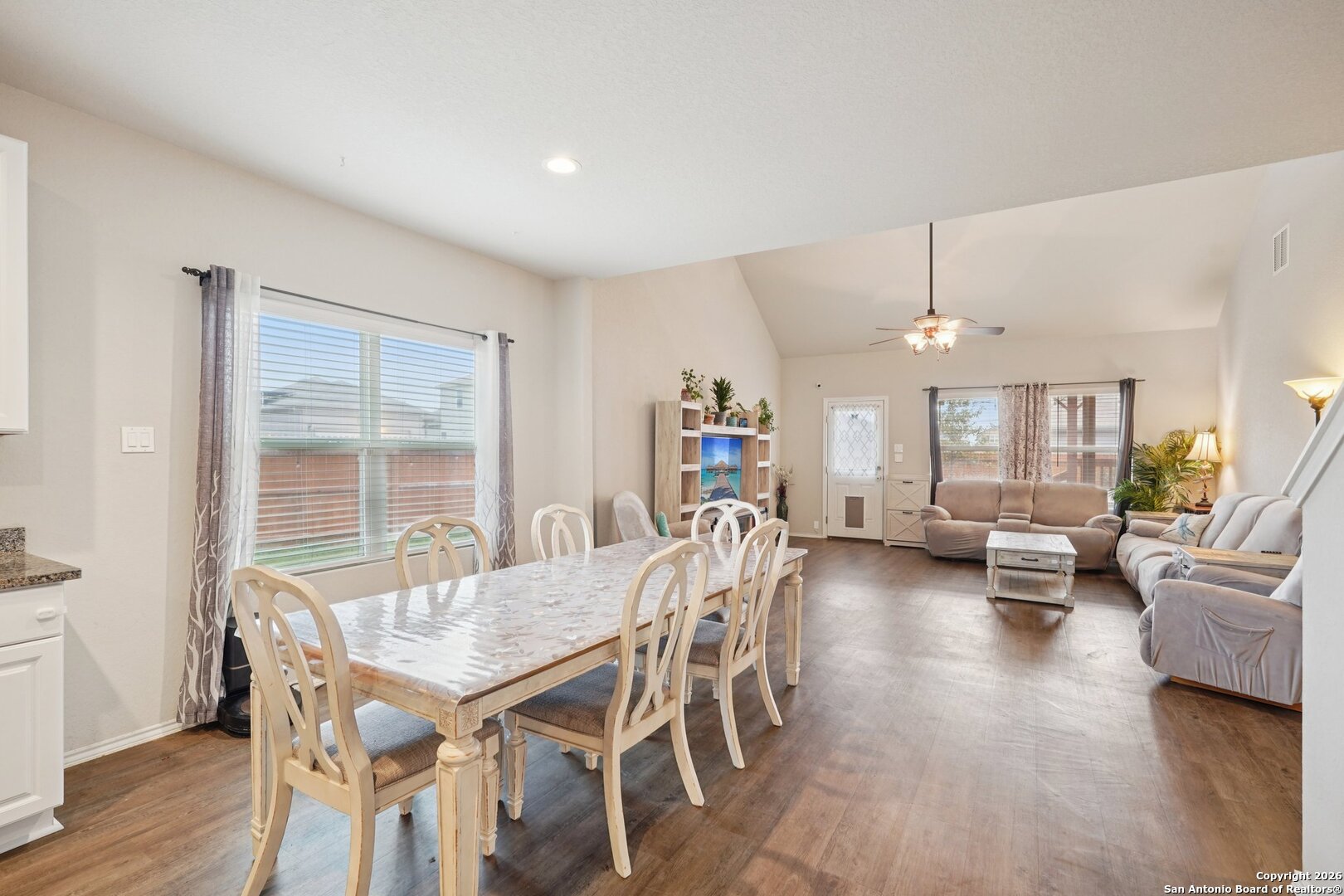 13030 Heathers Reef St. Hedwig, TX 78152 - Photo 6 of 51 a view of a dining room with furniture window and wooden floor