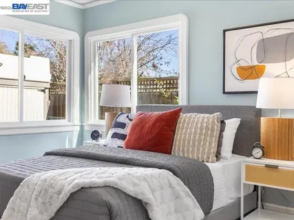 a bedroom with bed and a window