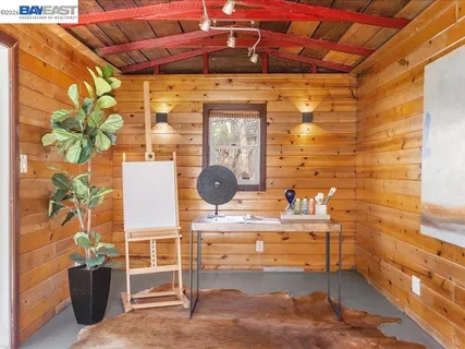 a backyard of a house with a table and chairs