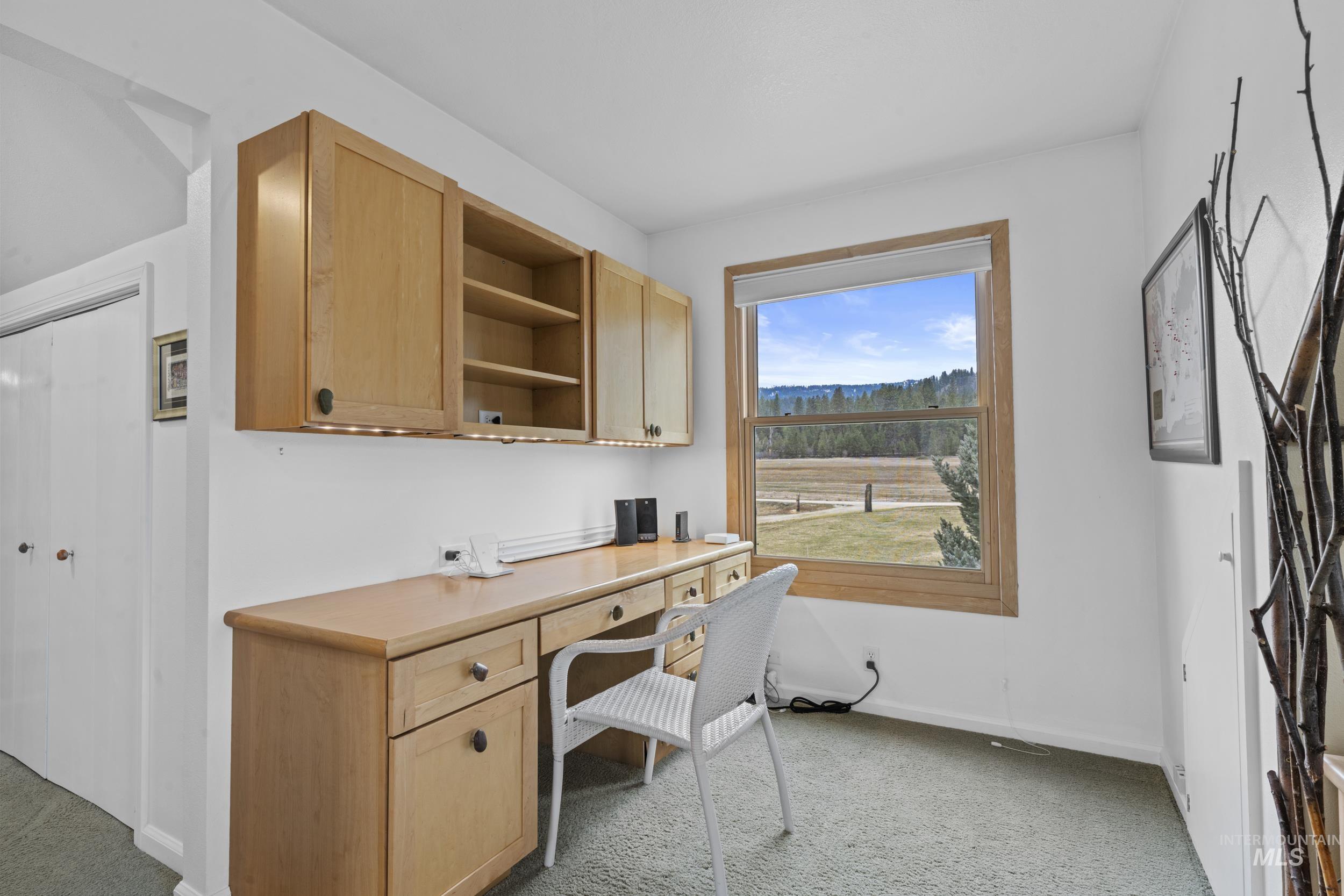 69 River Ranch Road Garden Valley, ID 83622 - Photo 24 of 50 Office area featuring built in desk and light carpet