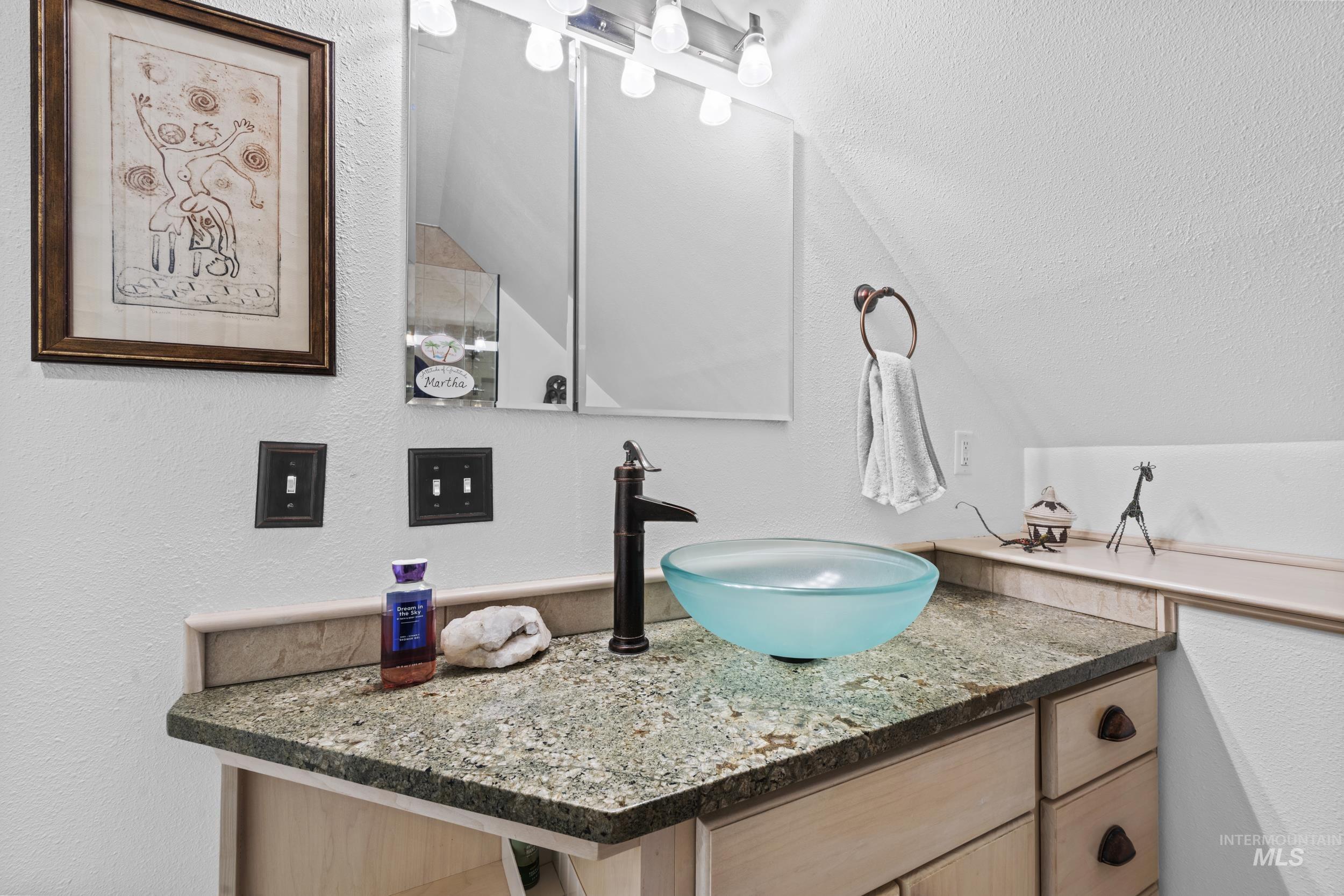 69 River Ranch Road Garden Valley, ID 83622 - Photo 26 of 50 Bathroom with a textured wall and vanity
