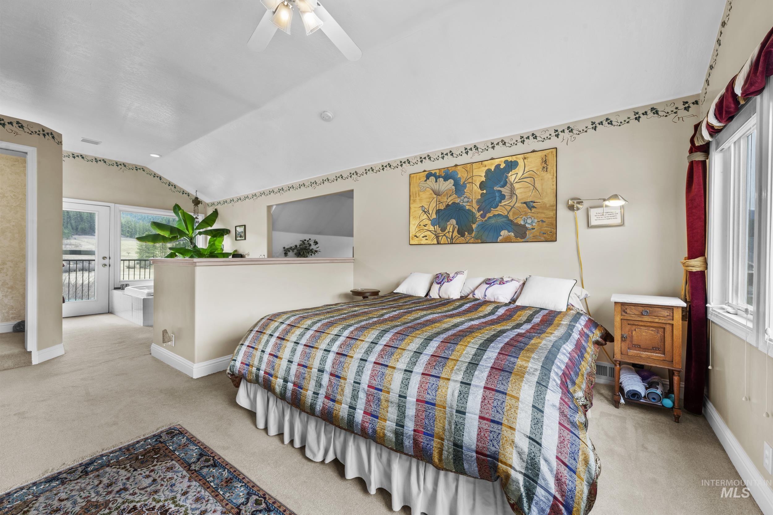 69 River Ranch Road Garden Valley, ID 83622 - Photo 30 of 50 Bedroom with lofted ceiling, ceiling fan, light carpet, and access to exterior