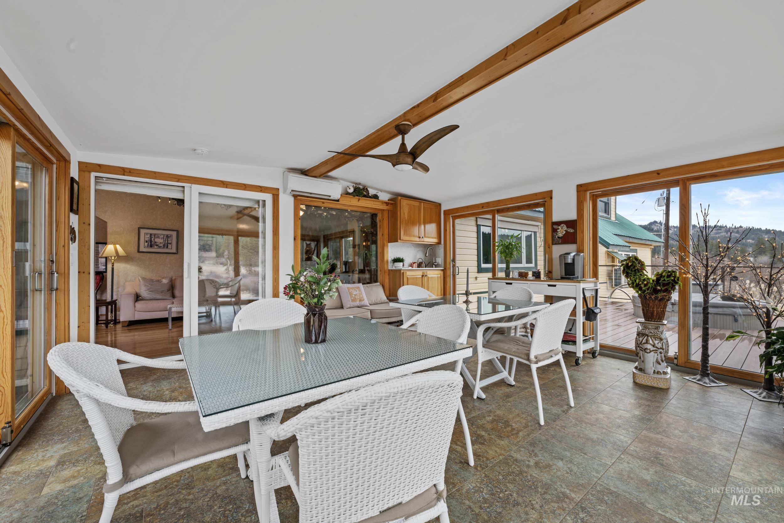 69 River Ranch Road Garden Valley, ID 83622 - Photo 35 of 50 Stone finish floors, a ceiling fan, and lofted ceiling with beams