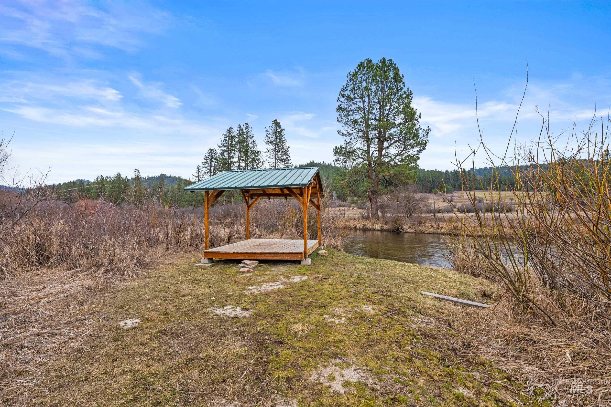 69 River Ranch Road Garden Valley, ID 83622 - Photo 44 of 50 Dock with a water view and a lawn