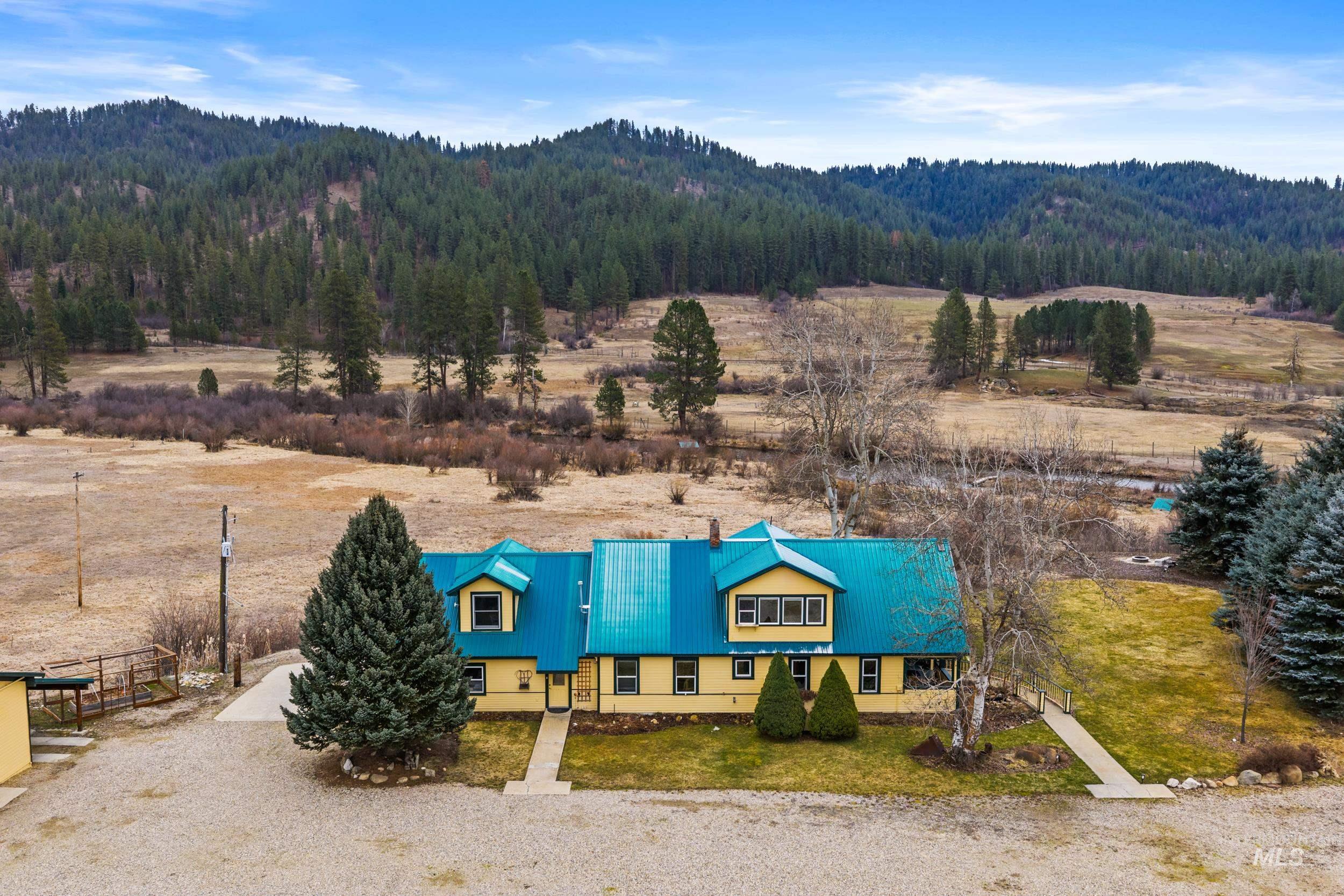 69 River Ranch Road Garden Valley, ID 83622 - Photo 49 of 50 Aerial view of sparsely populated area with mountains and a forest