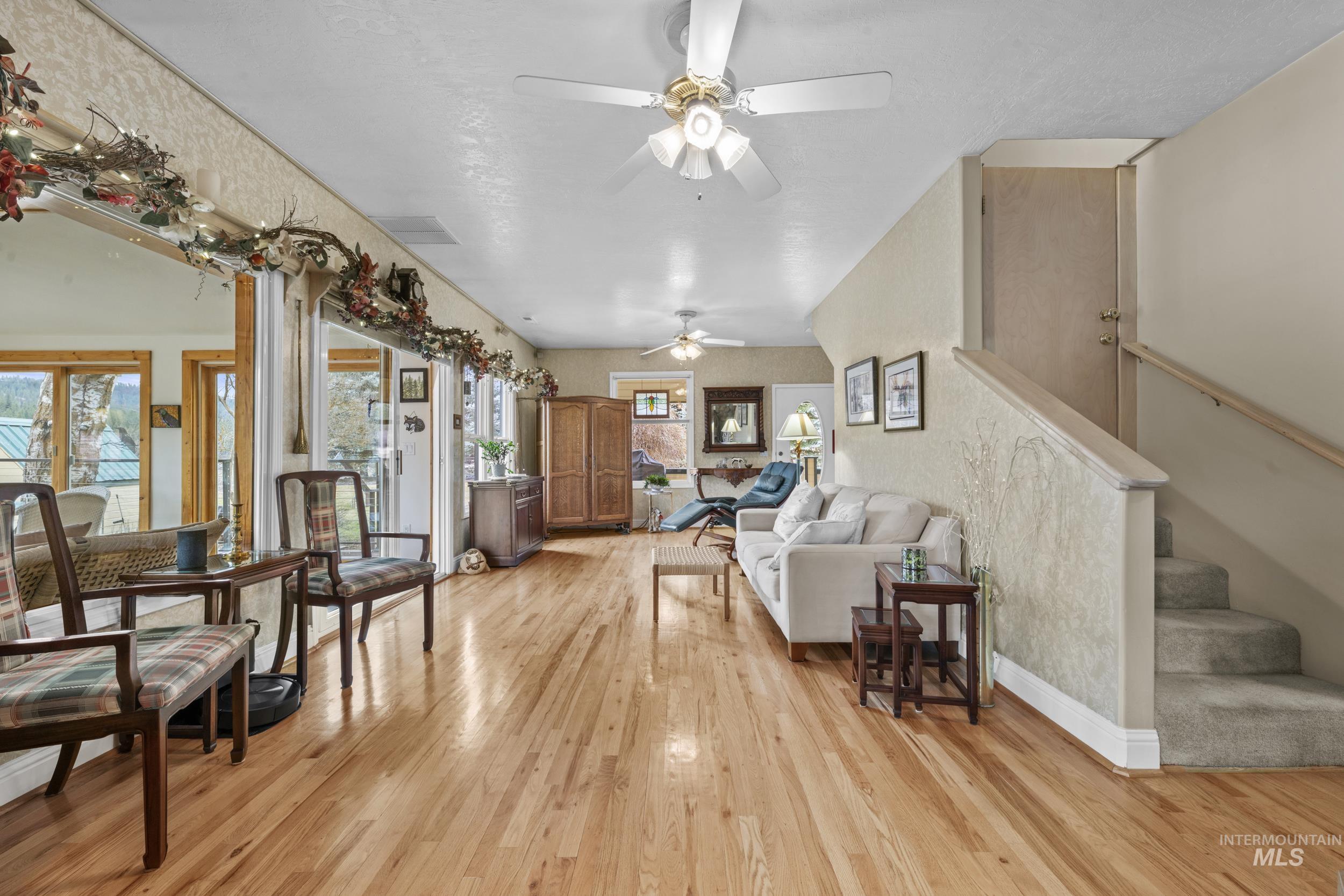 69 River Ranch Road Garden Valley, ID 83622 - Photo 7 of 50 Living area featuring light wood-style flooring and ceiling fan
