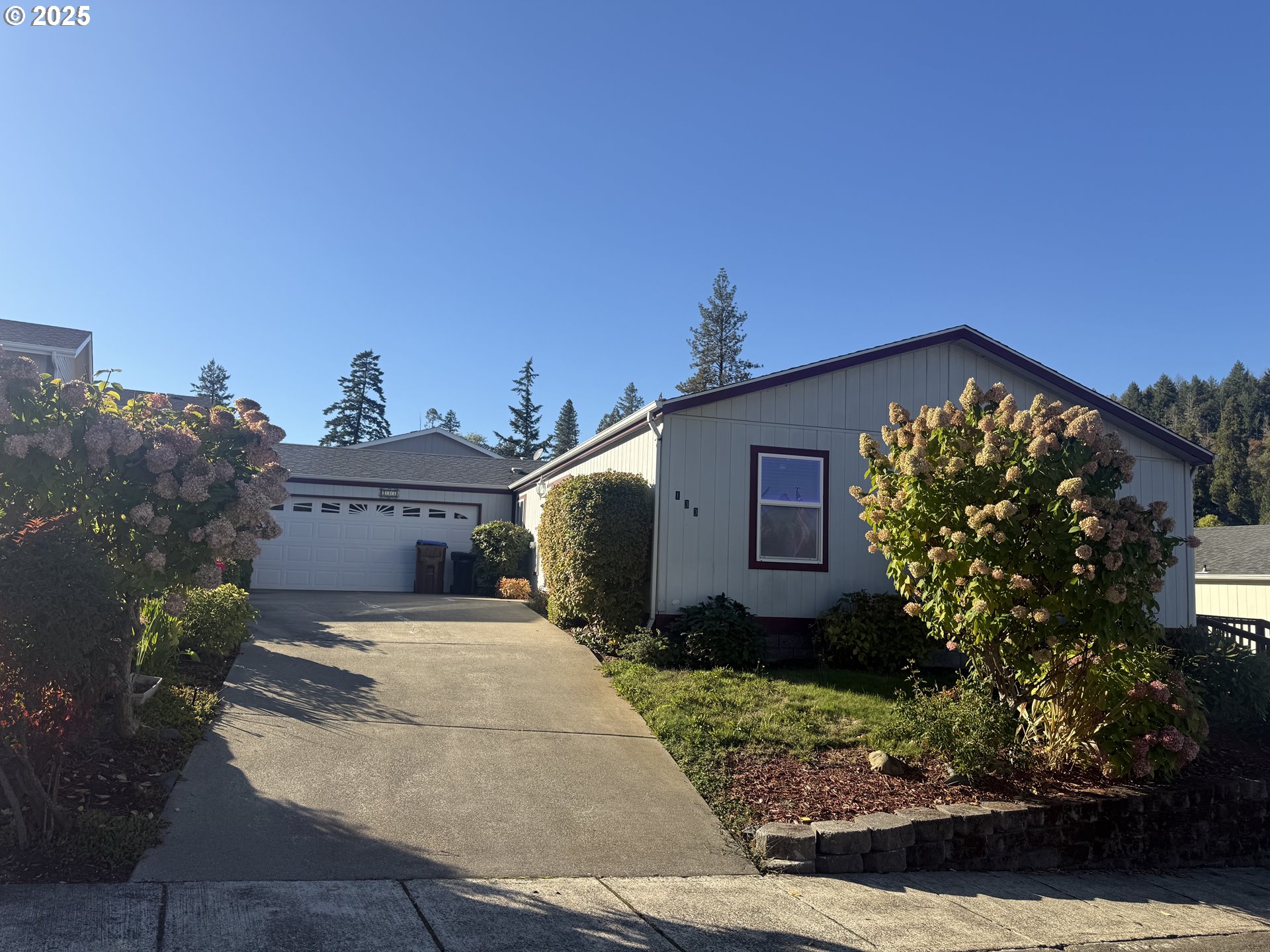 Undisclosed Address Canyonville, OR 97417 - Photo 2 of 24 a front view of a house with garden