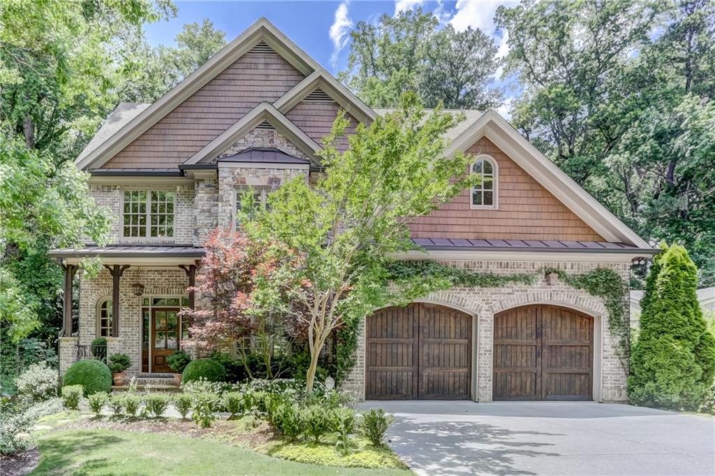 1627 Tryon Road Northeast Brookhaven, GA 30341 - Photo 1 of 1 a front view of a house with garden