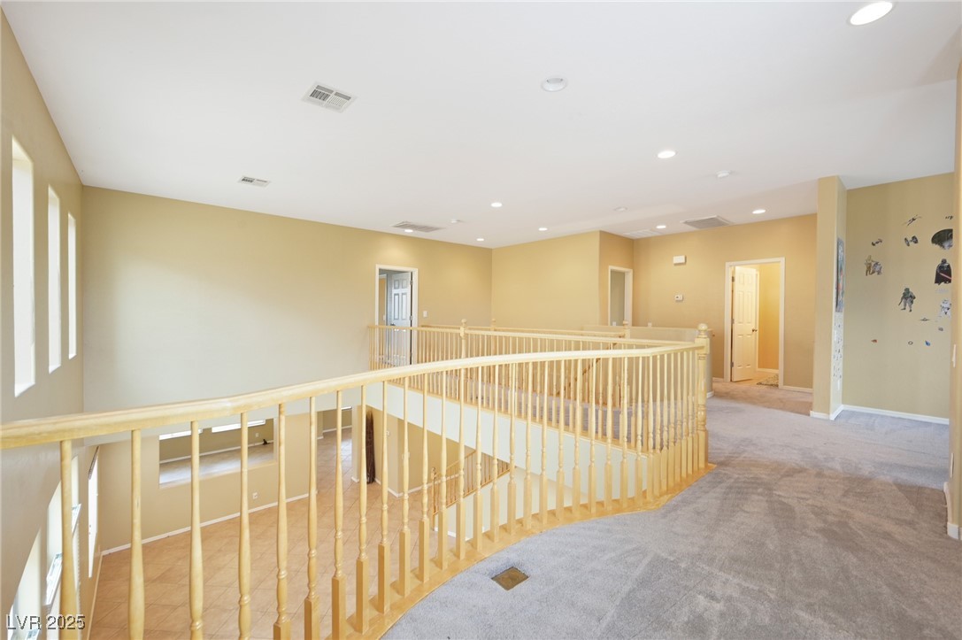 2289 Manosque Lane Henderson, NV 89044 - Photo 16 of 35 Hallway with an upstairs landing, carpet floors, and recessed lighting