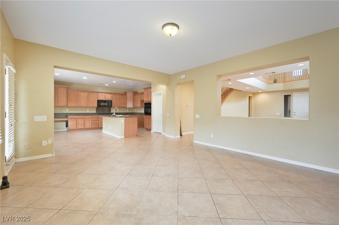 2289 Manosque Lane Henderson, NV 89044 - Photo 2 of 35 Unfurnished living room featuring light tile patterned floors and recessed lighting
