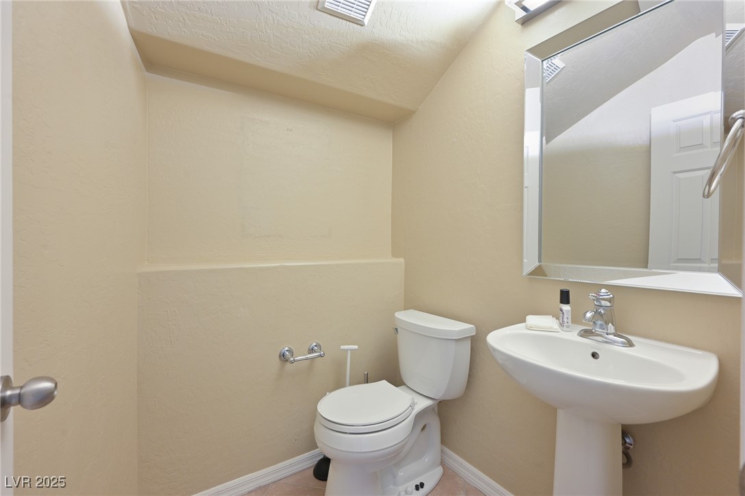 2289 Manosque Lane Henderson, NV 89044 - Photo 28 of 35 Bathroom with a textured ceiling and tile patterned flooring