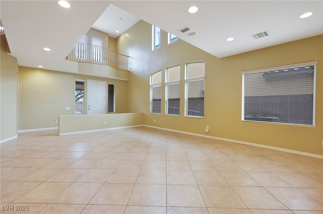 2289 Manosque Lane Henderson, NV 89044 - Photo 3 of 35 Empty room featuring recessed lighting, a high ceiling, and light tile patterned floors
