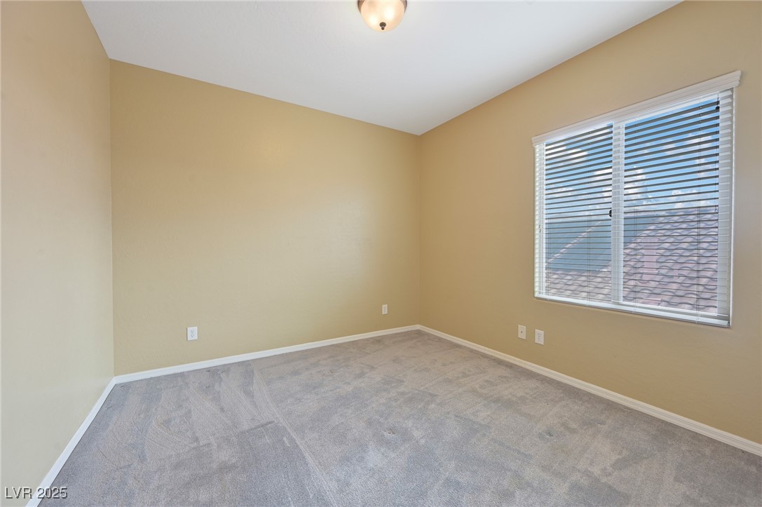 2289 Manosque Lane Henderson, NV 89044 - Photo 31 of 35 Carpeted empty room featuring baseboards