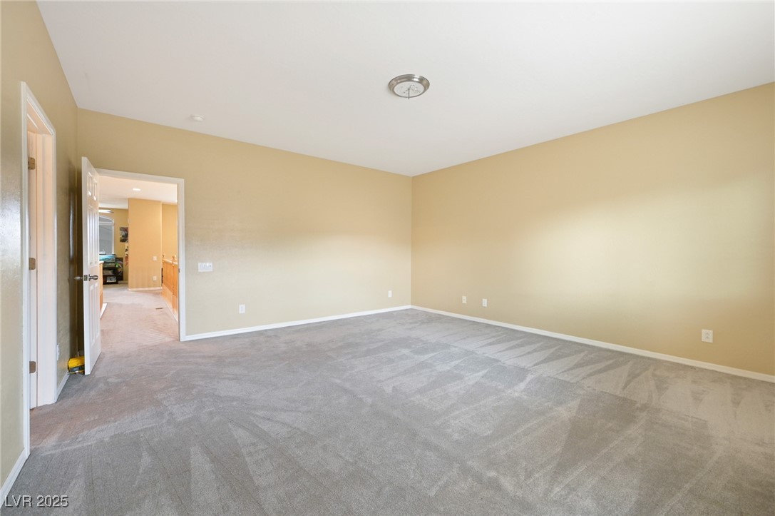 2289 Manosque Lane Henderson, NV 89044 - Photo 32 of 35 Unfurnished room with carpet flooring and baseboards