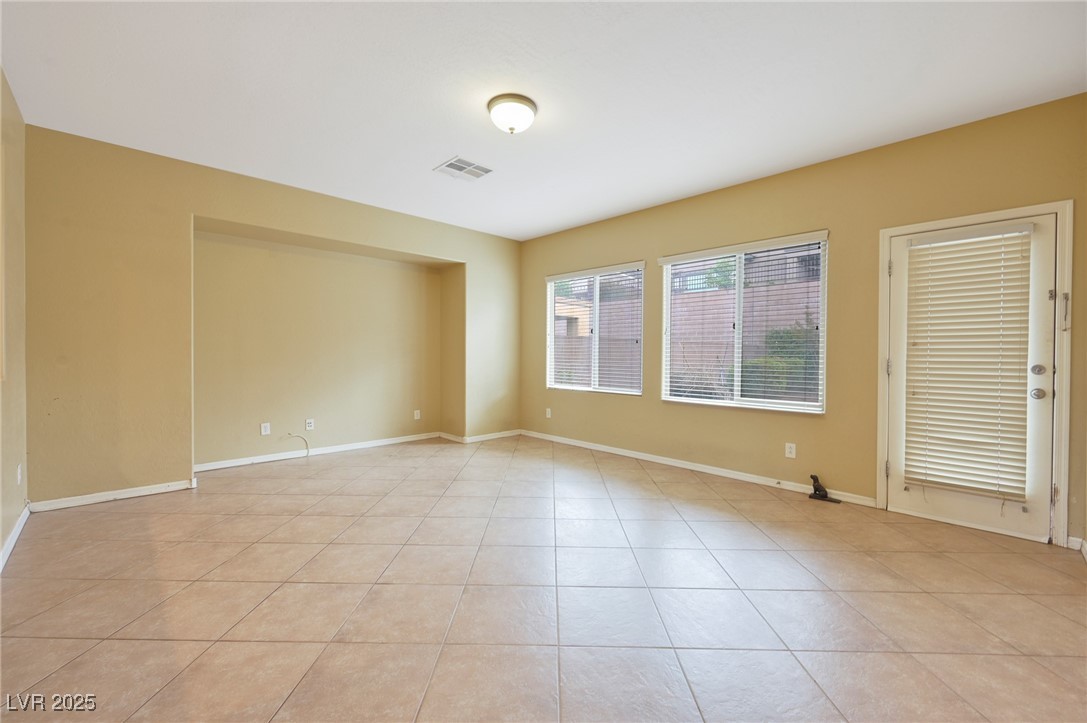 2289 Manosque Lane Henderson, NV 89044 - Photo 6 of 35 Empty room with light tile patterned floors