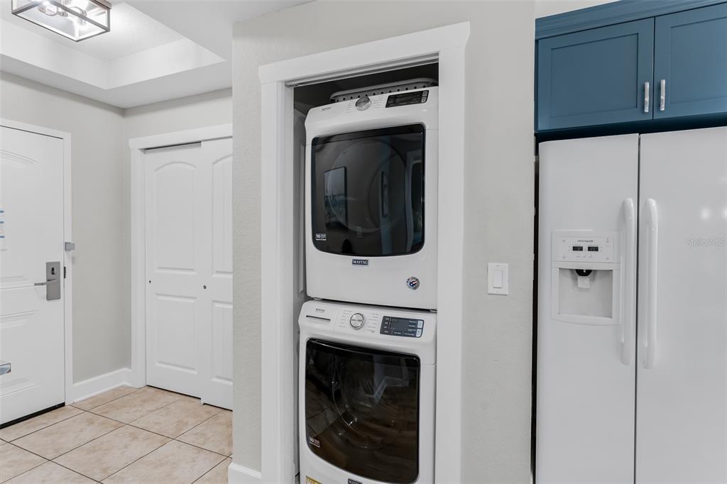 399 2nd Street, Unit 215 Indian Rocks Beach, FL 33785 - Photo 15 of 51 a view of a hallway with washer and dryer