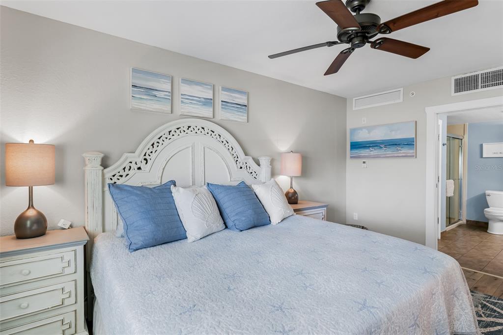 399 2nd Street, Unit 215 Indian Rocks Beach, FL 33785 - Photo 17 of 51 a bedroom with a bed and a ceiling fan