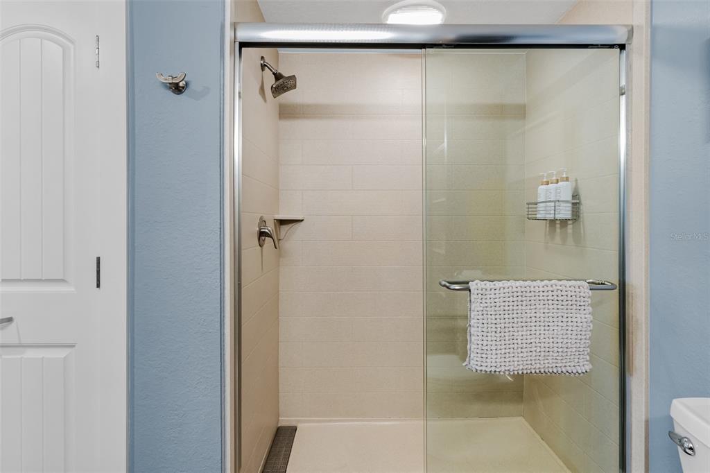 399 2nd Street, Unit 215 Indian Rocks Beach, FL 33785 - Photo 21 of 51 a bathroom with a shower